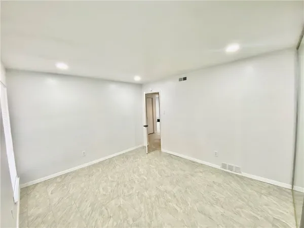 an empty room with an entryway