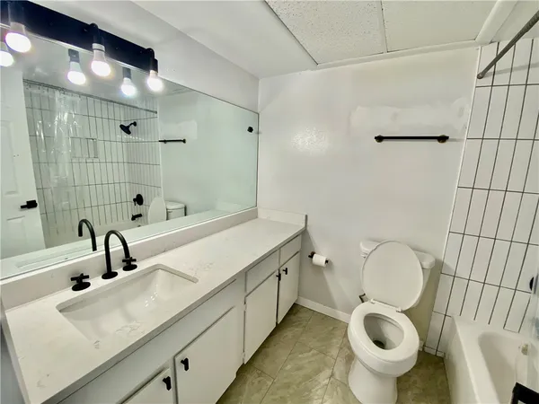 a bathroom with a sink and mirror