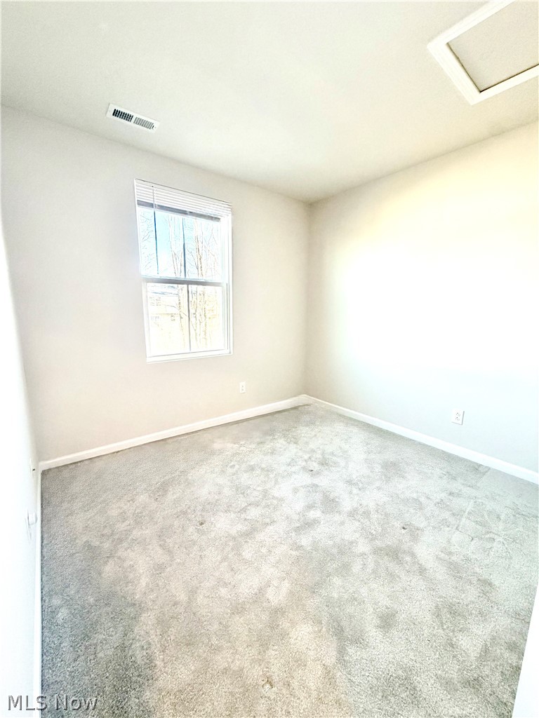 153 Raintree Lane Painesville, OH 44077 - Photo 11 of 13 Spare room featuring carpet flooring and baseboards