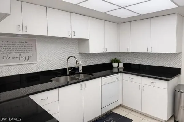 a kitchen with a sink and cabinets