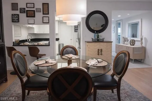 a spacious bedroom with a bed couch and windows