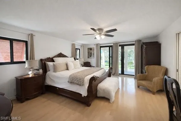 a bedroom with bed and window