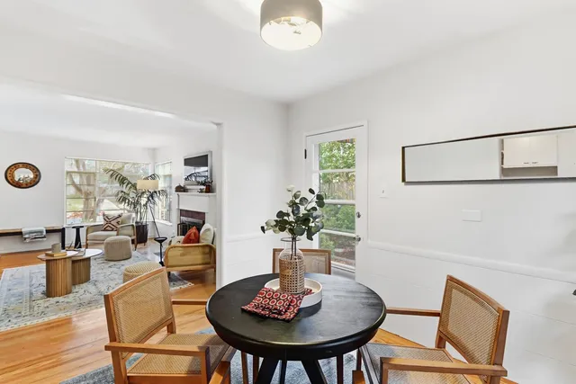 a dining room with furniture and window
