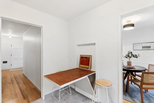 a room with a table and chairs