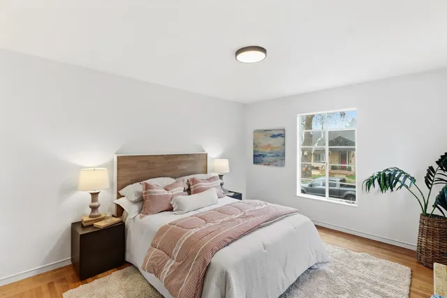 a bedroom with bed and a window