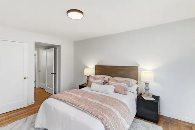 a bedroom with a bed and a closet