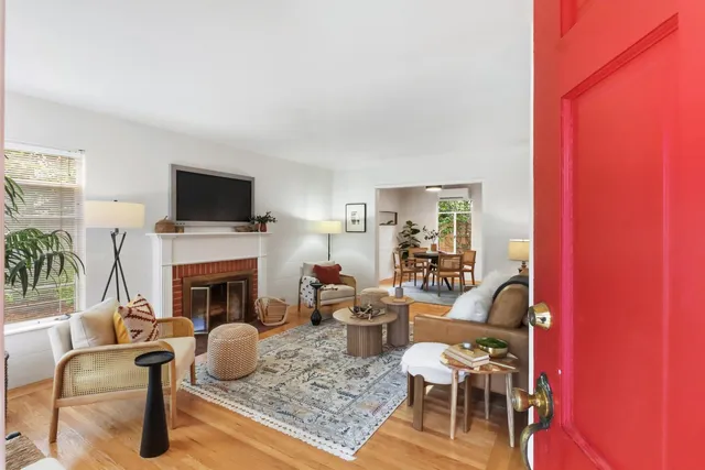 a living room with furniture and a fireplace
