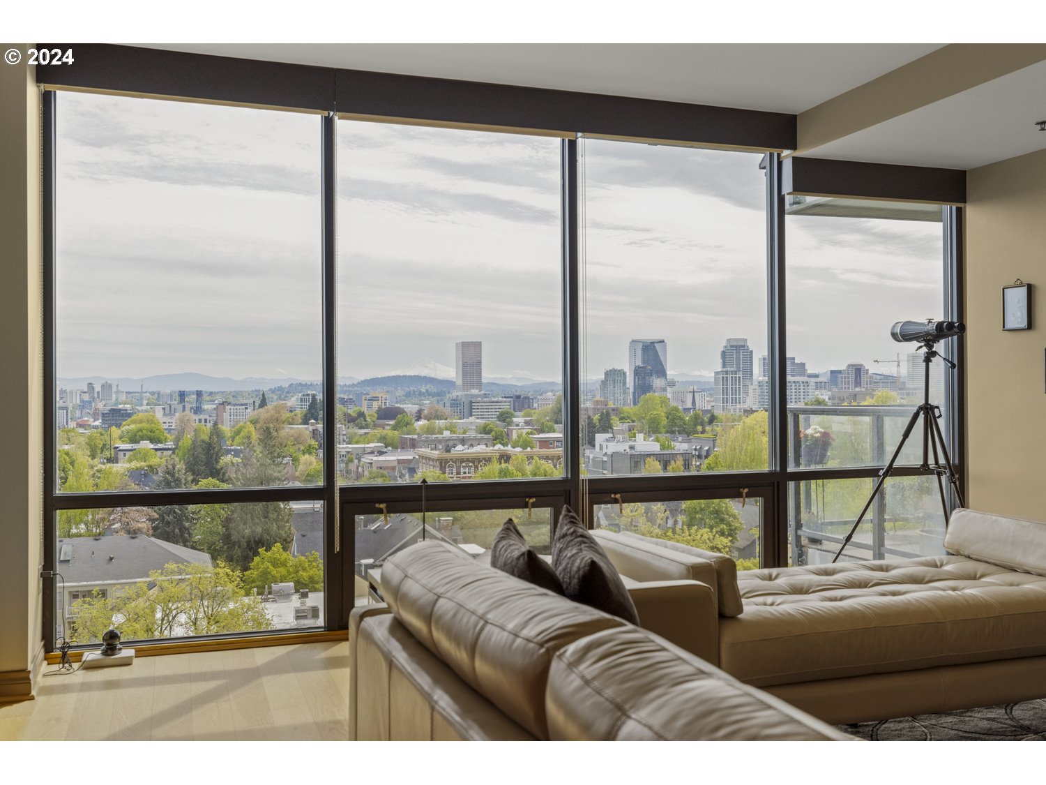 2454 Northwest Westover Road, Unit 405 Portland, OR 97210 - Photo 13 of 37 a living room with couches and a large window with balcony view