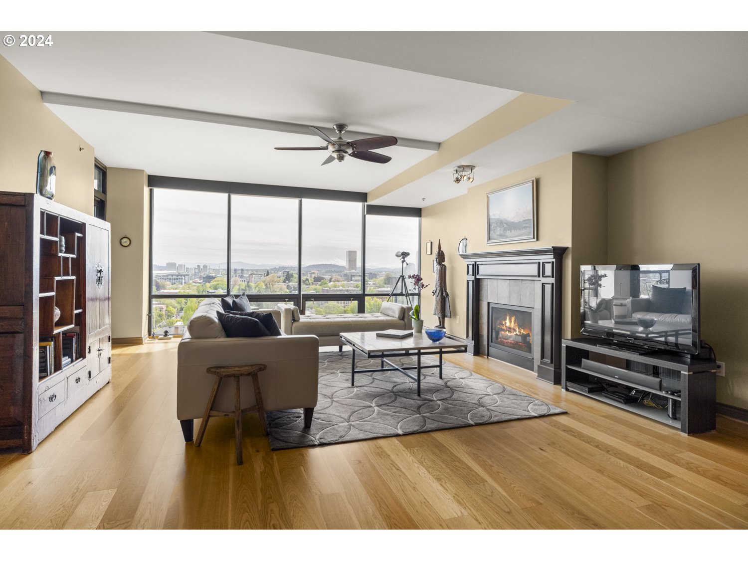 2454 Northwest Westover Road, Unit 405 Portland, OR 97210 - Photo 15 of 37 a living room with fireplace furniture and a large window