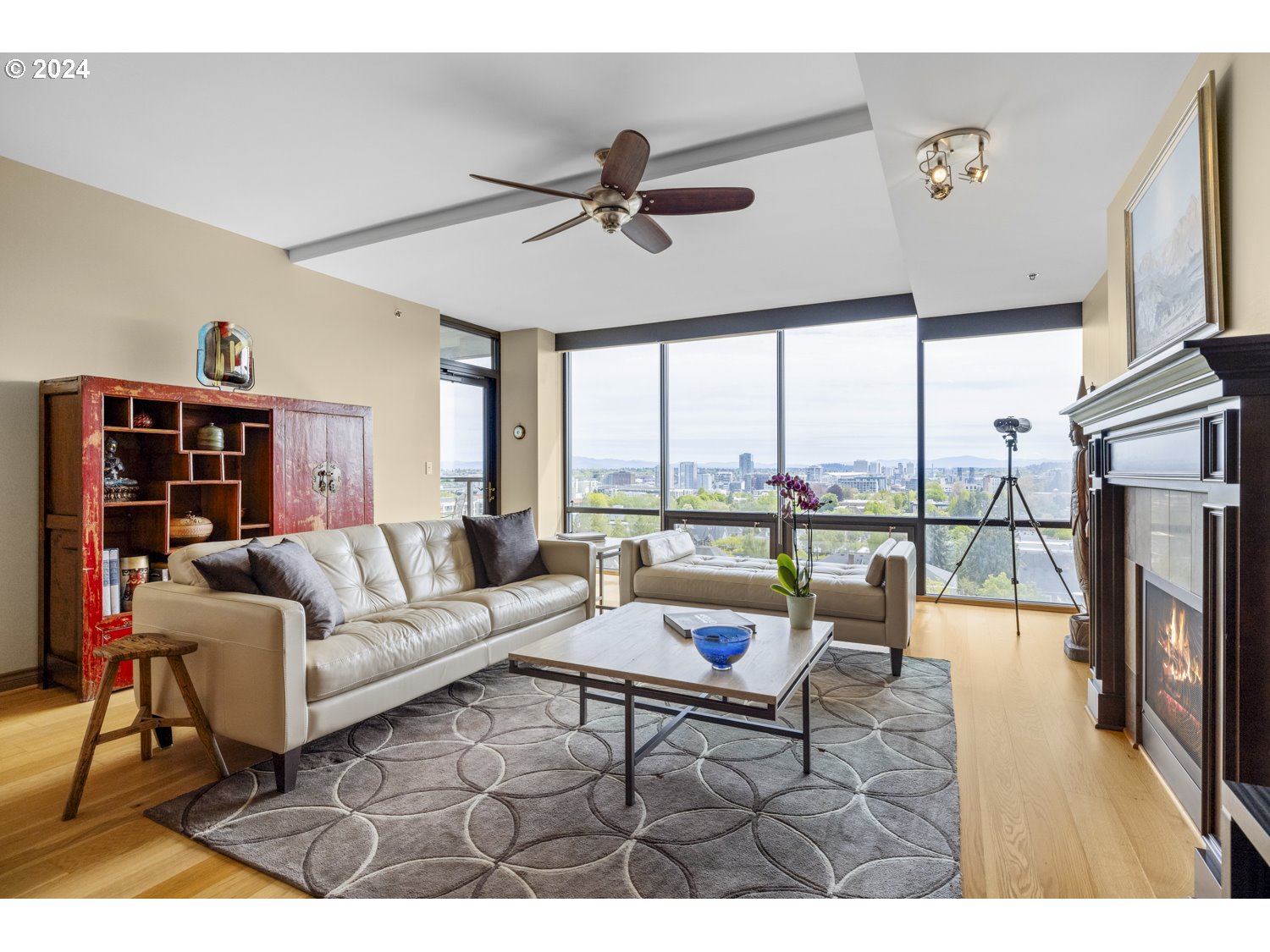 2454 Northwest Westover Road, Unit 405 Portland, OR 97210 - Photo 16 of 37 a living room with furniture a floor to ceiling window and a flat screen tv