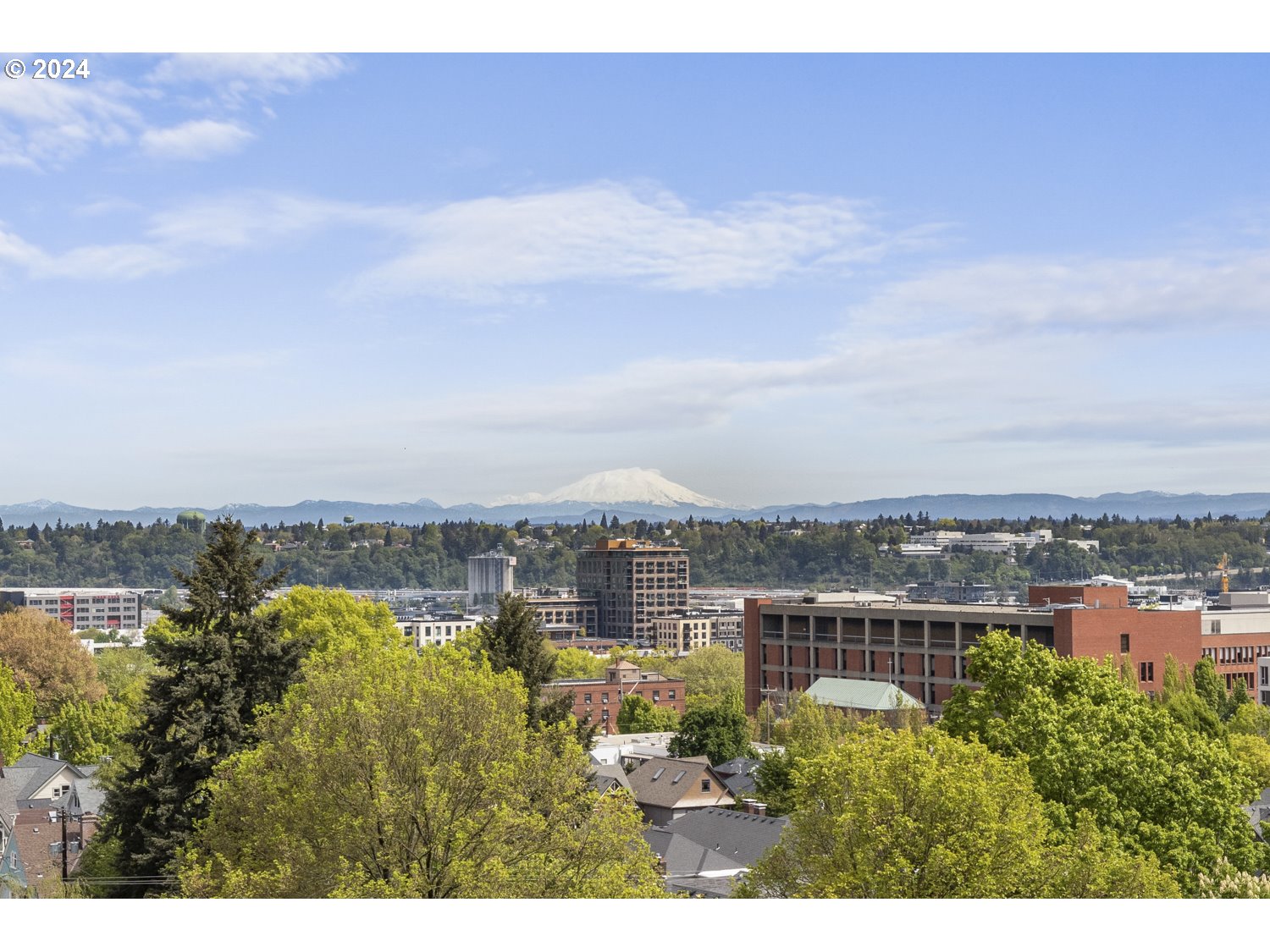 2454 Northwest Westover Road, Unit 405 Portland, OR 97210 - Photo 18 of 37 a view of a city and a lake