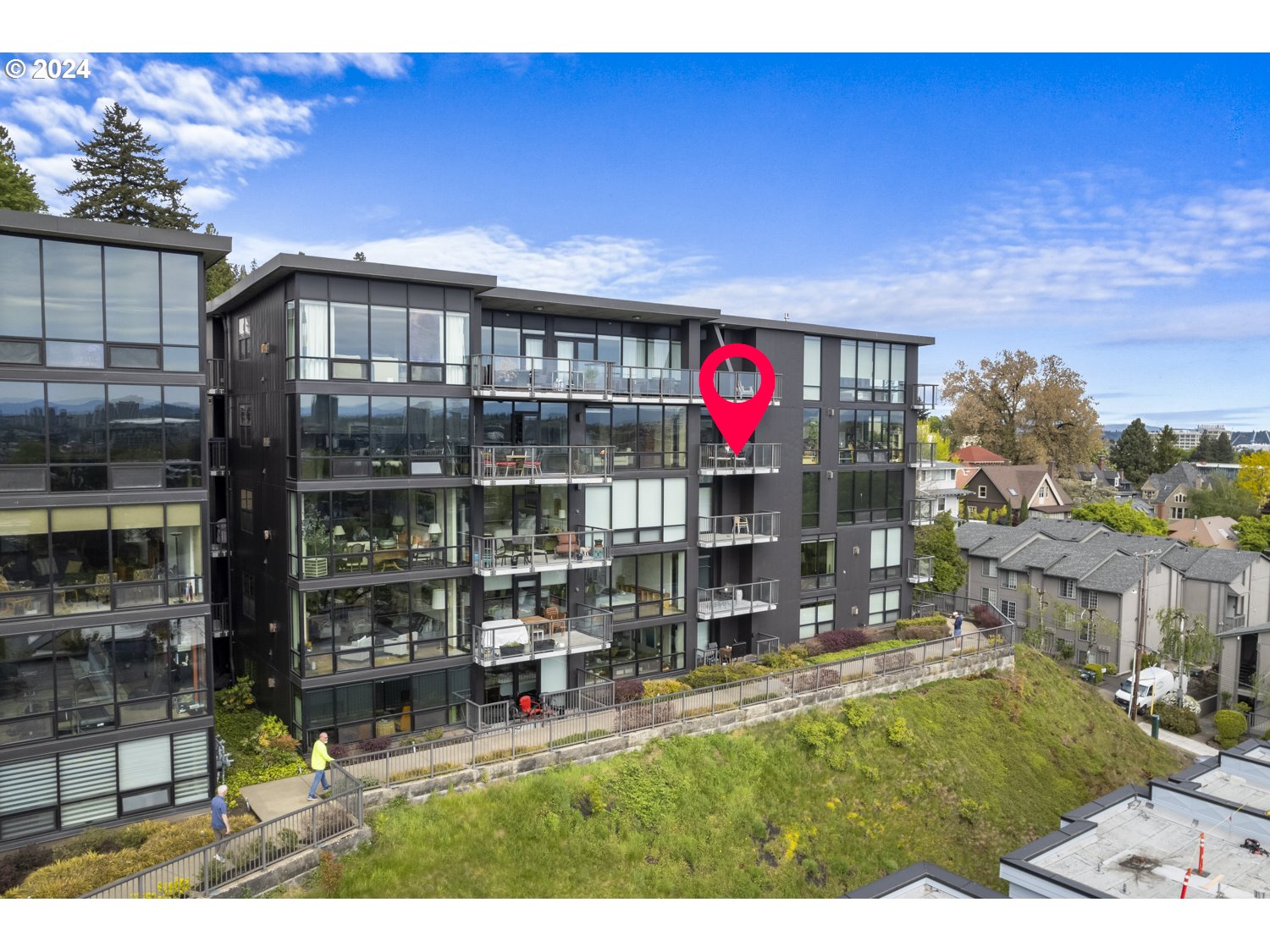 2454 Northwest Westover Road, Unit 405 Portland, OR 97210 - Photo 2 of 37 a front view of a house with a yard