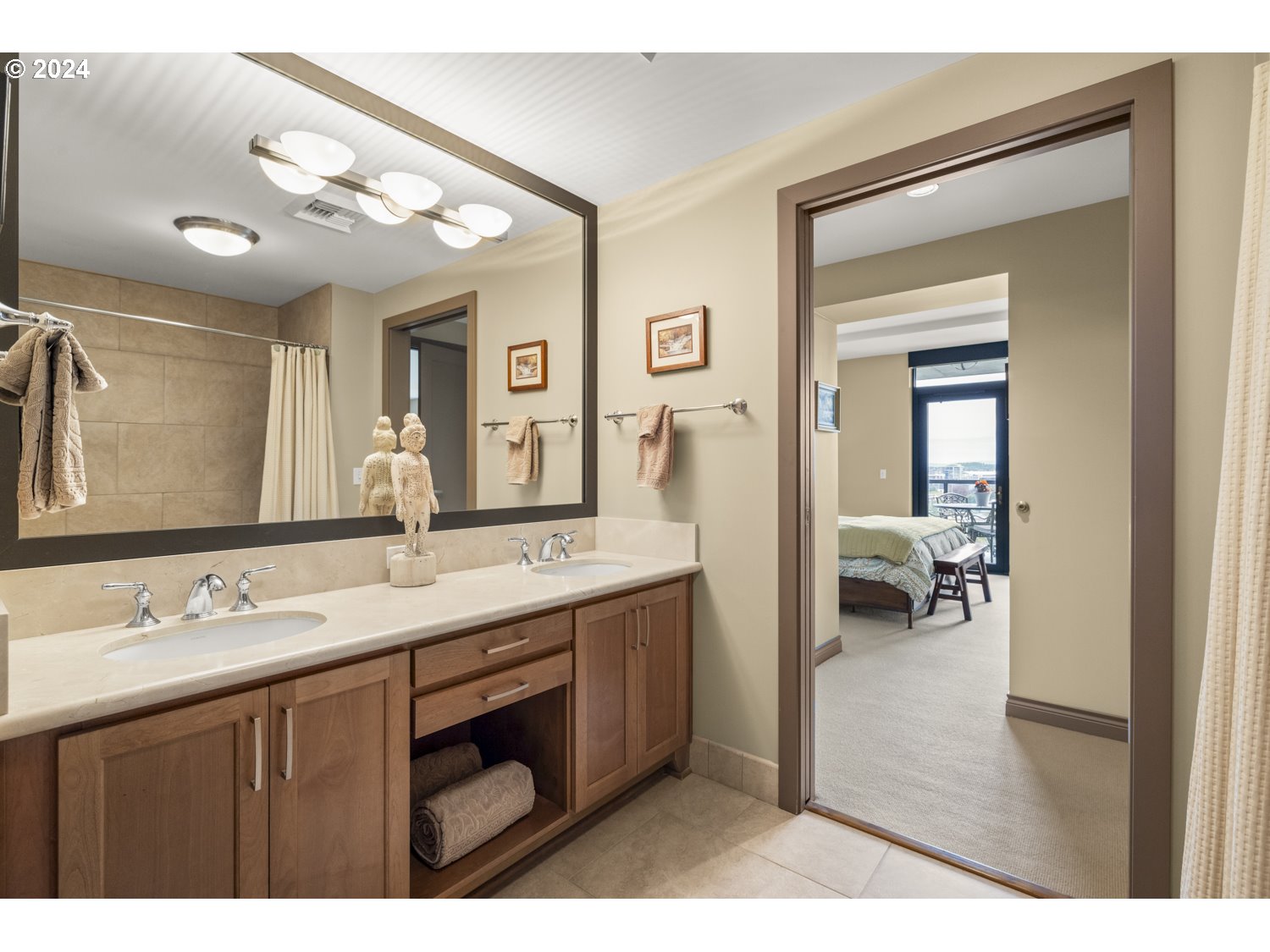 2454 Northwest Westover Road, Unit 405 Portland, OR 97210 - Photo 25 of 37 a bathroom with a sink double vanity and a mirror