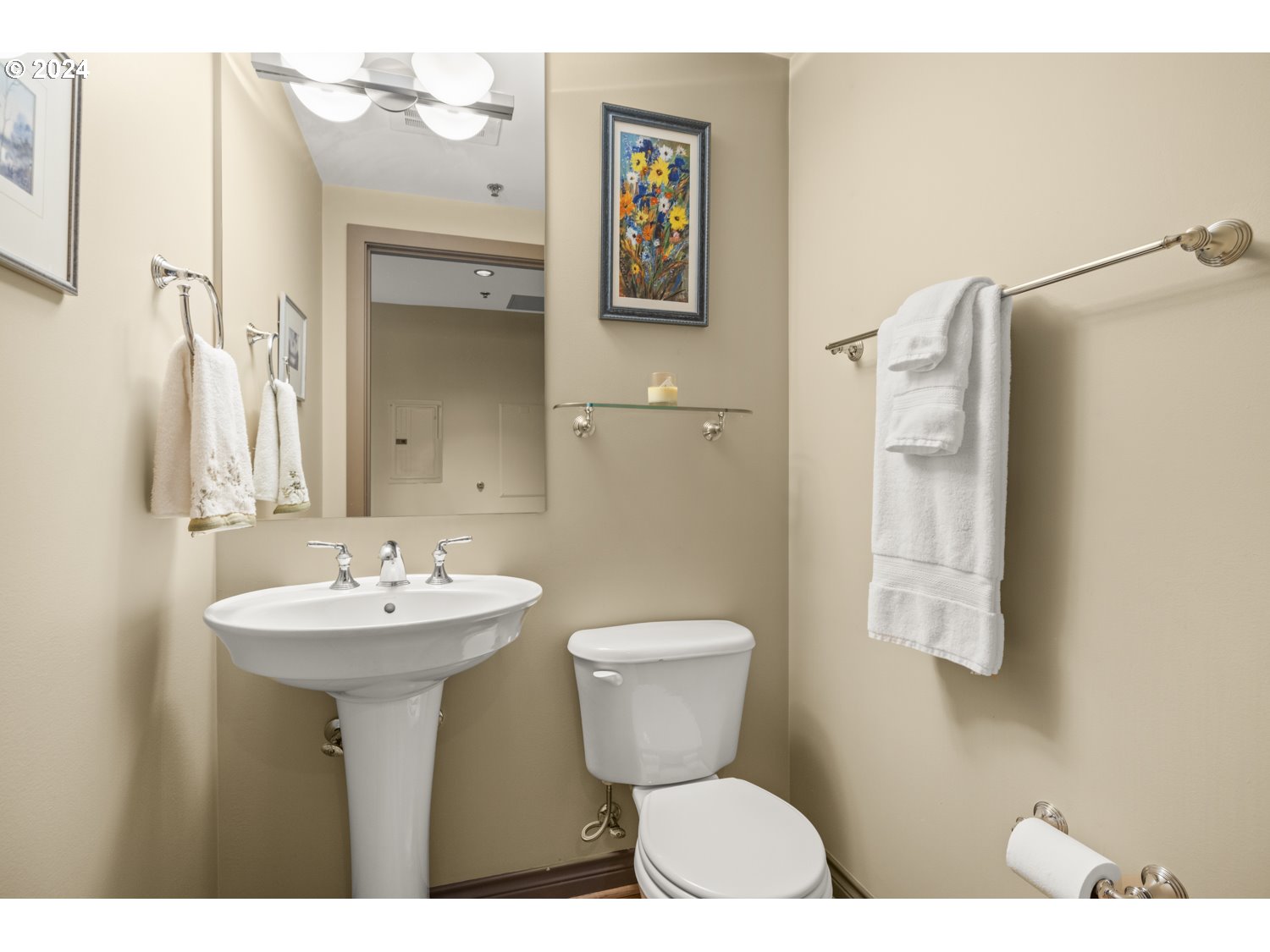 2454 Northwest Westover Road, Unit 405 Portland, OR 97210 - Photo 31 of 37 a bathroom with a sink mirror toilet and vanity