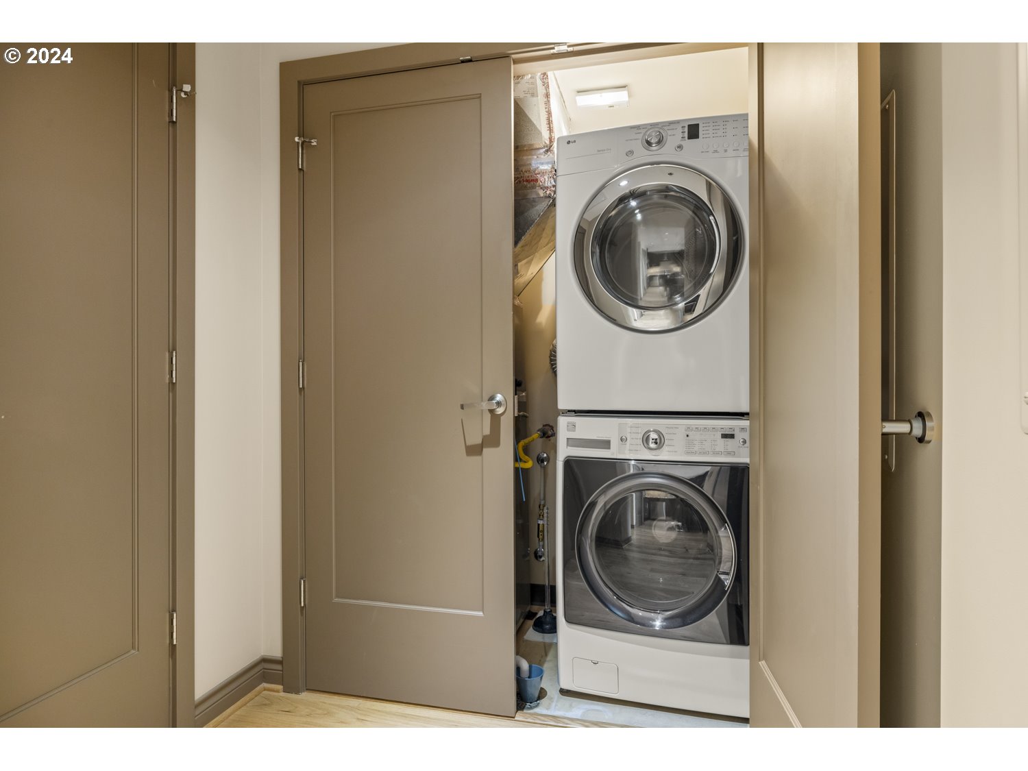 2454 Northwest Westover Road, Unit 405 Portland, OR 97210 - Photo 32 of 37 a view of a washer and dryer in a utility room
