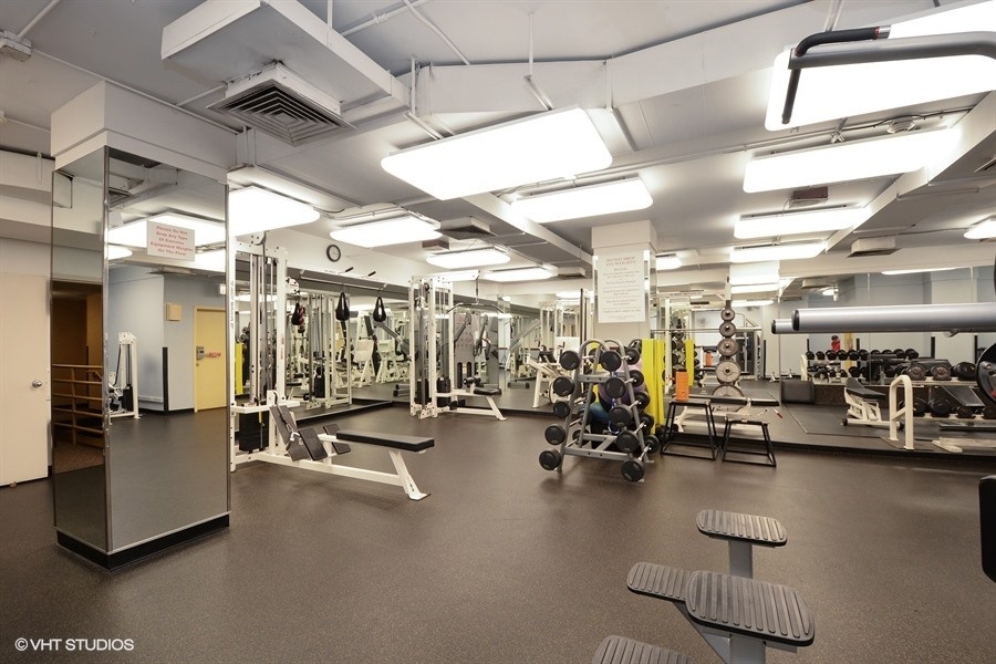 211 East Ohio Street, Unit 2011 Chicago, IL 60611 - Photo 14 of 19 a view of a room with gym equipment