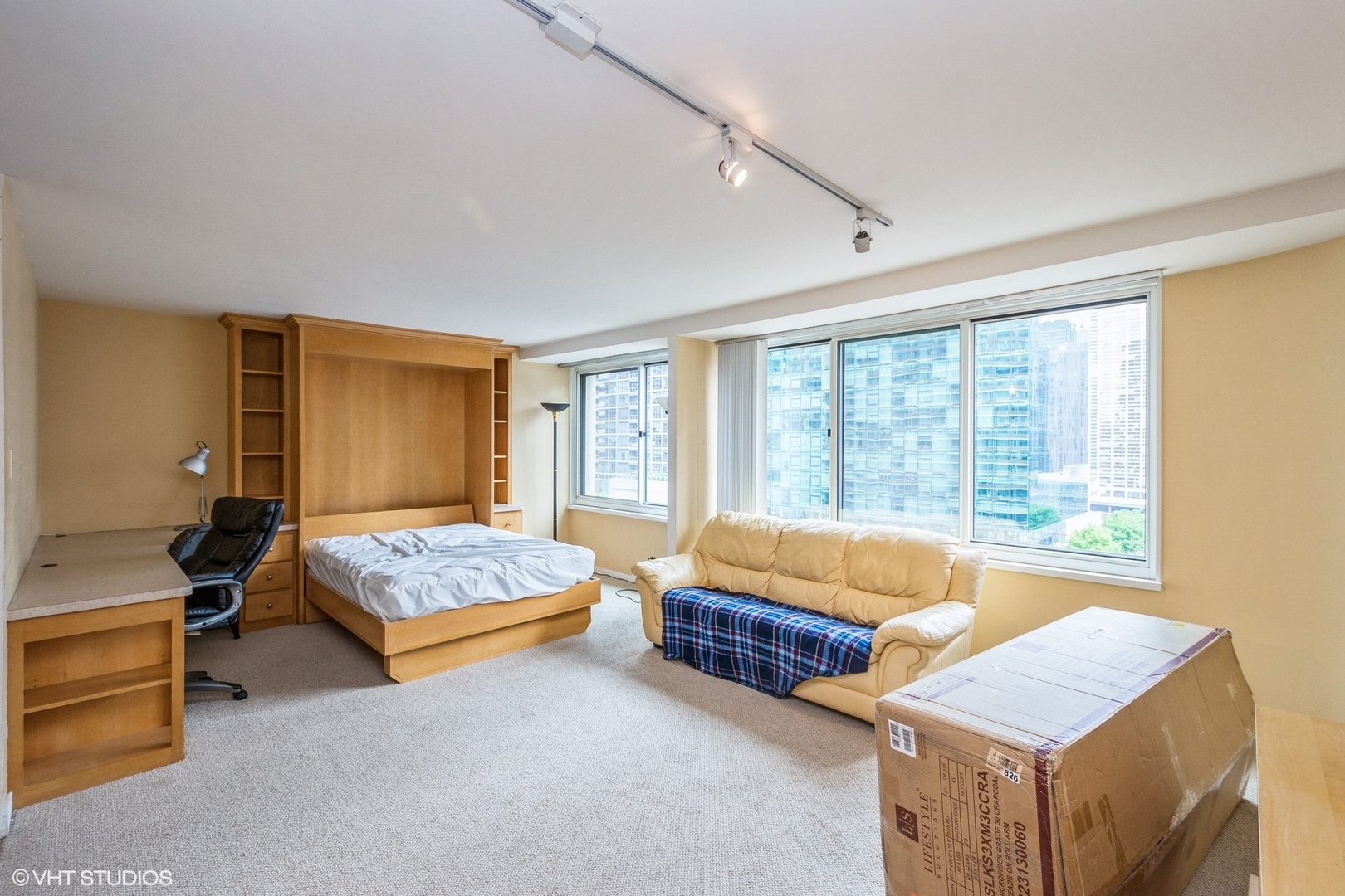 211 East Ohio Street, Unit 2011 Chicago, IL 60611 - Photo 3 of 19 a bedroom with furniture and window