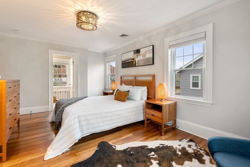 54 Merrill Road Watertown, MA 02472 - Photo 23 of 36 a bedroom with a bed and a window