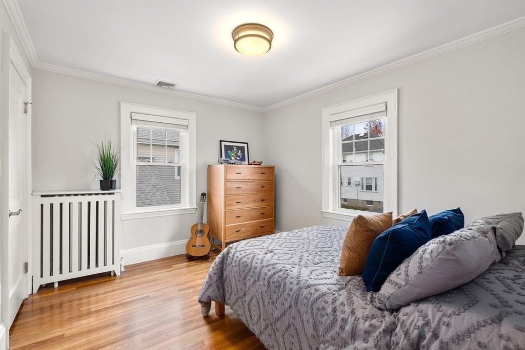 54 Merrill Road Watertown, MA 02472 - Photo 27 of 36 a bedroom with a bed and a window