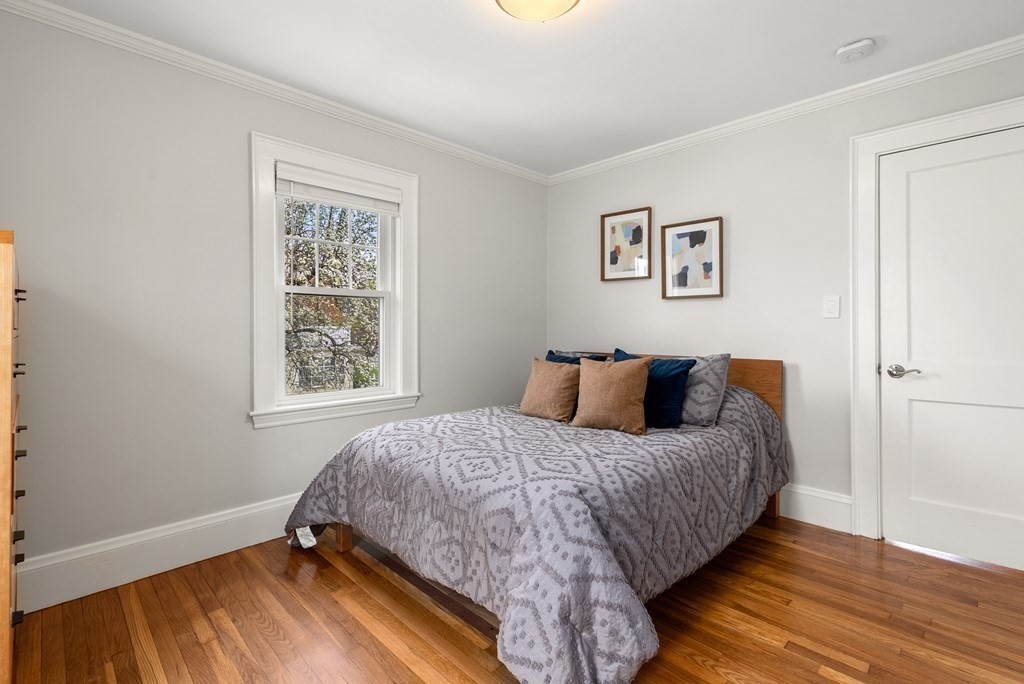 54 Merrill Road Watertown, MA 02472 - Photo 28 of 36 a bedroom with a bed and a window