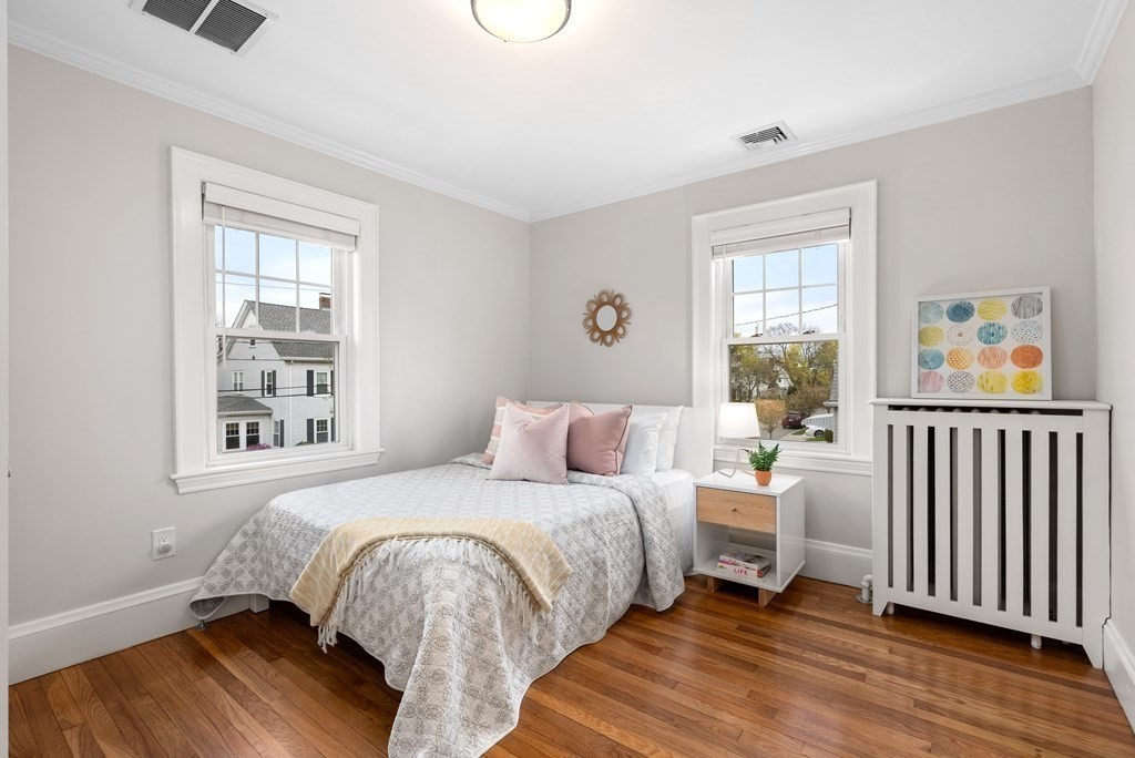 54 Merrill Road Watertown, MA 02472 - Photo 29 of 36 a bedroom with a bed and a window
