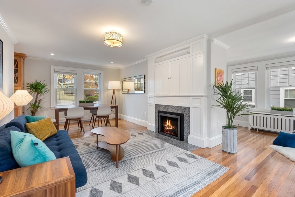 54 Merrill Road Watertown, MA 02472 - Photo 3 of 36 a living room with furniture and a fireplace
