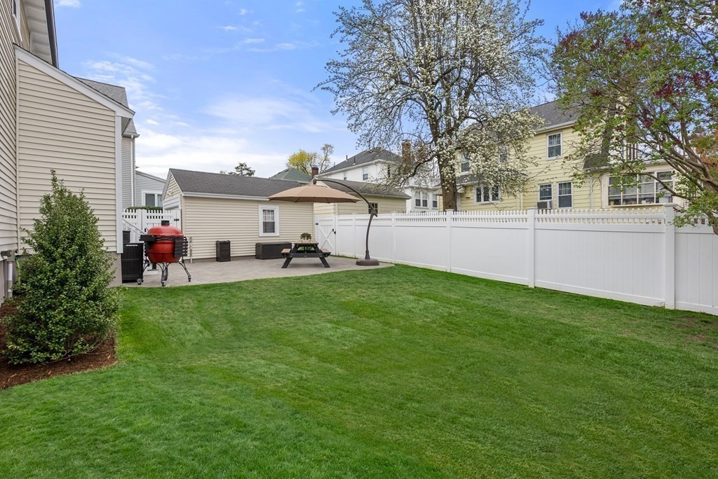54 Merrill Road Watertown, MA 02472 - Photo 35 of 36 a view of a house with a back yard