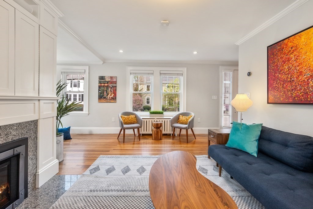 54 Merrill Road Watertown, MA 02472 - Photo 7 of 36 a living room with furniture and a fireplace