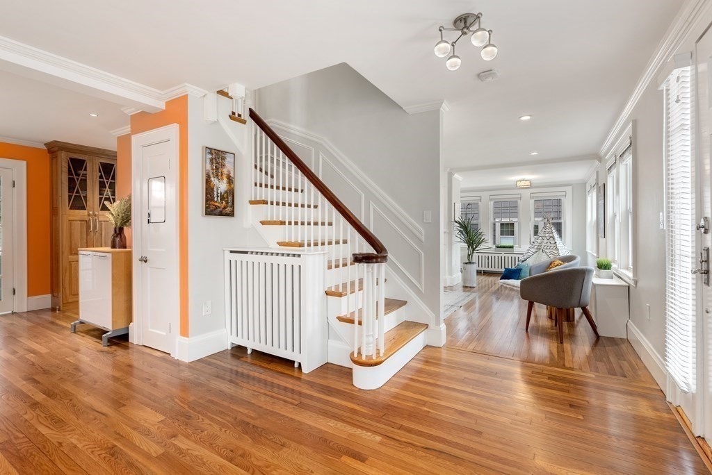 54 Merrill Road Watertown, MA 02472 - Photo 9 of 36 a view of a livingroom with furniture wooden floor and window