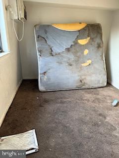 3107 Naylor Road Southeast, Unit 203 Washington, DC 20020 - Photo 8 of 29 a view of a room with a wooden floor and bench