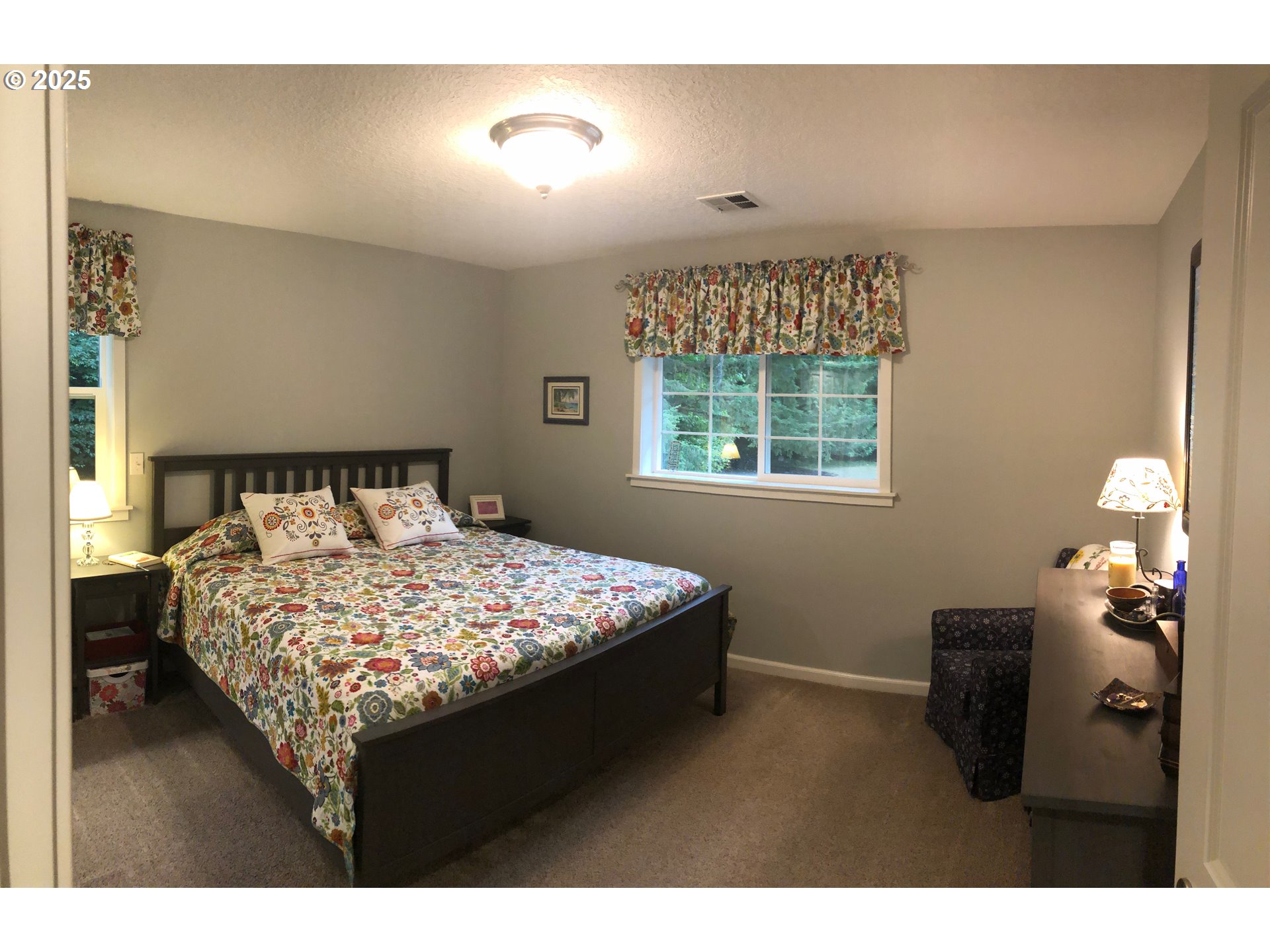 62941 Northwest Cochran Road Timber, OR 97144 - Photo 13 of 44 a bedroom with a bed and window