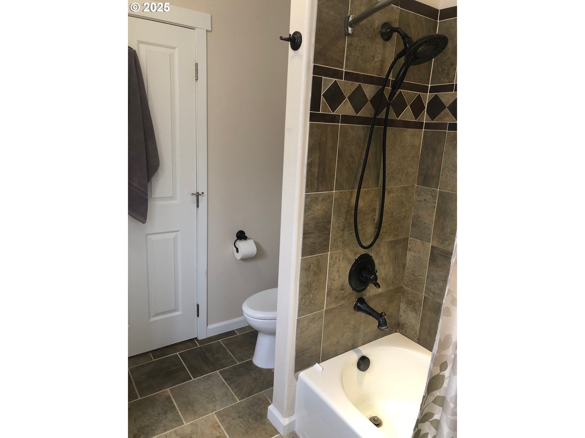 62941 Northwest Cochran Road Timber, OR 97144 - Photo 16 of 44 a bathroom with a toilet and a shower
