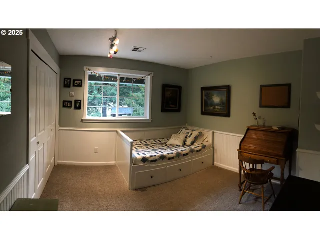 a bedroom with bed and window