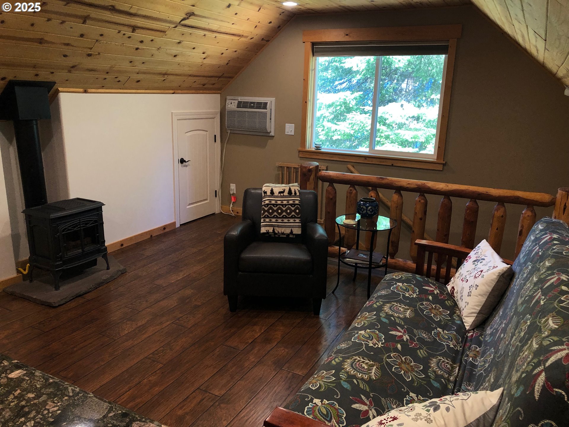 62941 Northwest Cochran Road Timber, OR 97144 - Photo 21 of 44 a living room with furniture and a window
