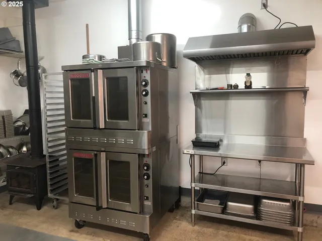 a refrigerator freezer sitting inside of a kitchen