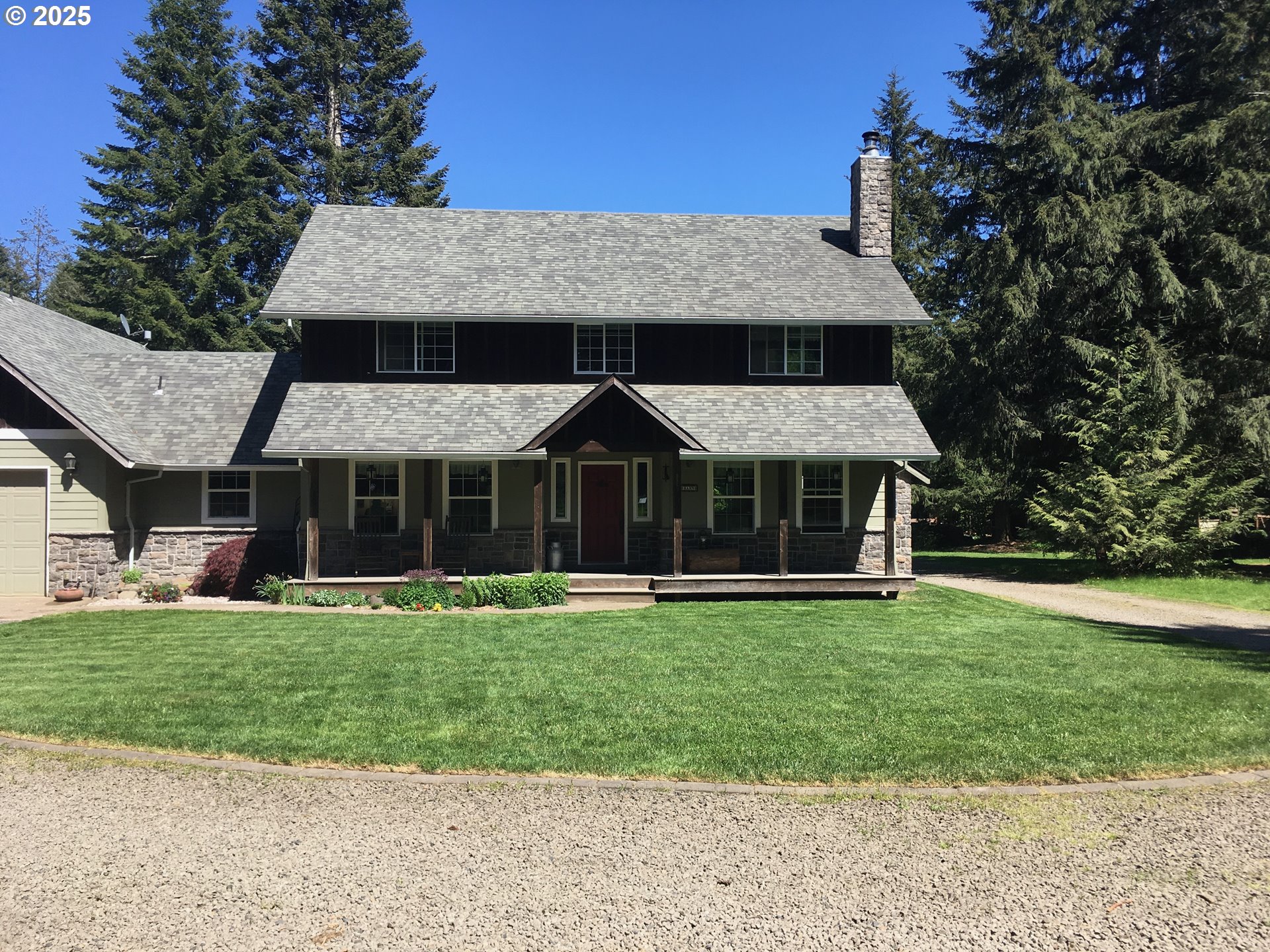 62941 Northwest Cochran Road Timber, OR 97144 - Photo 3 of 44 a front view of a house with a garden