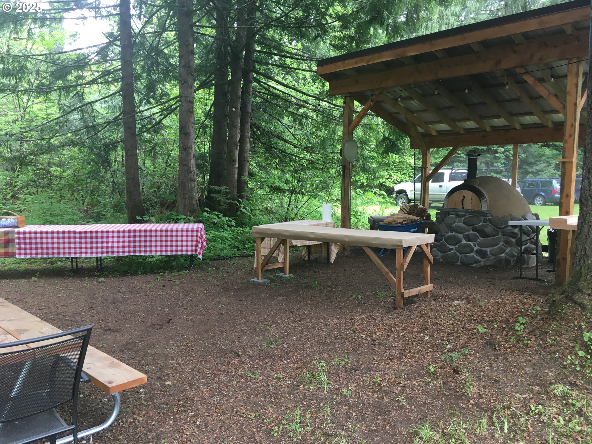 62941 Northwest Cochran Road Timber, OR 97144 - Photo 31 of 44 a view of backyard with lawn chairs and a yard