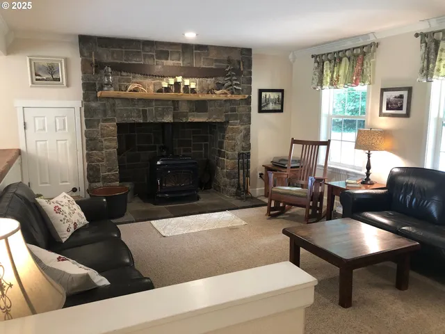 a kitchen with a stove and a fireplace