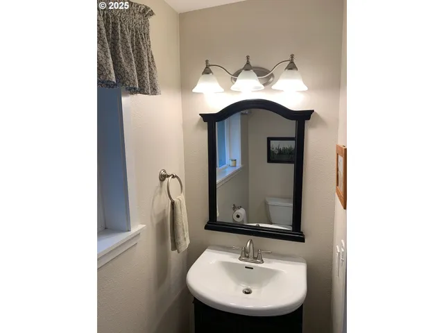 a large kitchen with a table and chairs in it