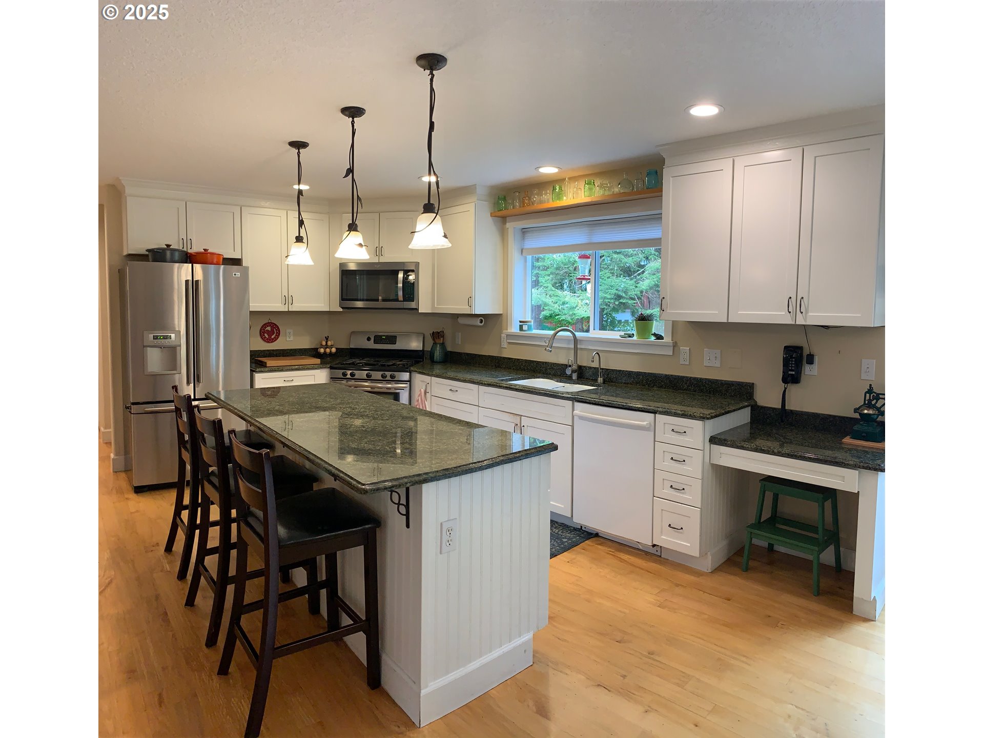 62941 Northwest Cochran Road Timber, OR 97144 - Photo 9 of 44 a kitchen with a sink stove and refrigerator