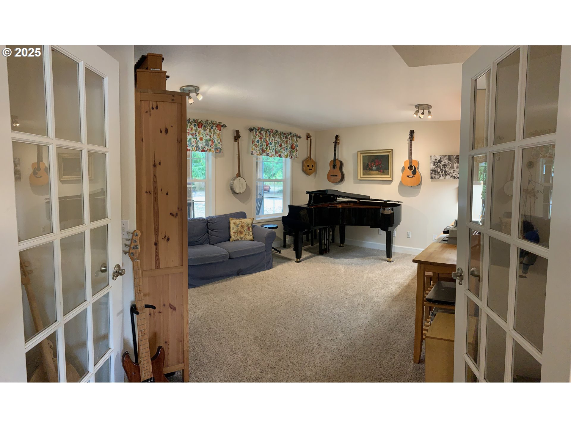 62941 Northwest Cochran Road Timber, OR 97144 - Photo 10 of 44 a living room with furniture a dining table and a piano table