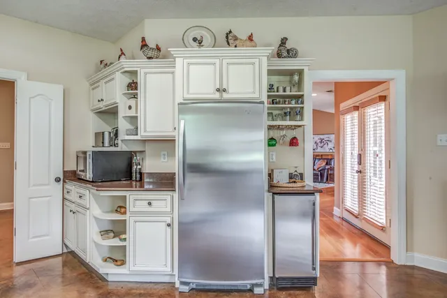 a kitchen with stainless steel appliances cabinets and a counter top space