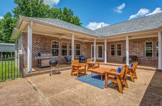 a outdoor space with a large pool and furniture