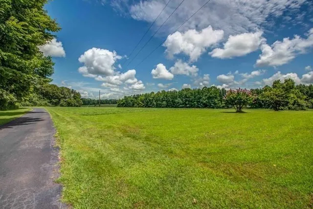 a view of a lake with a big yard