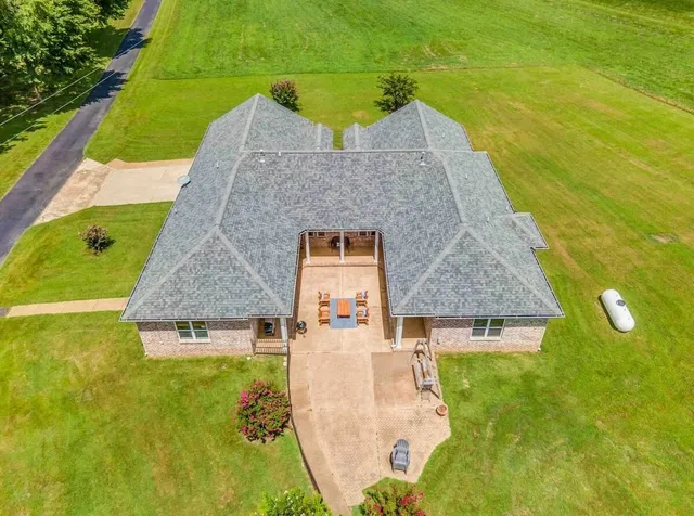swimming pool view with a garden