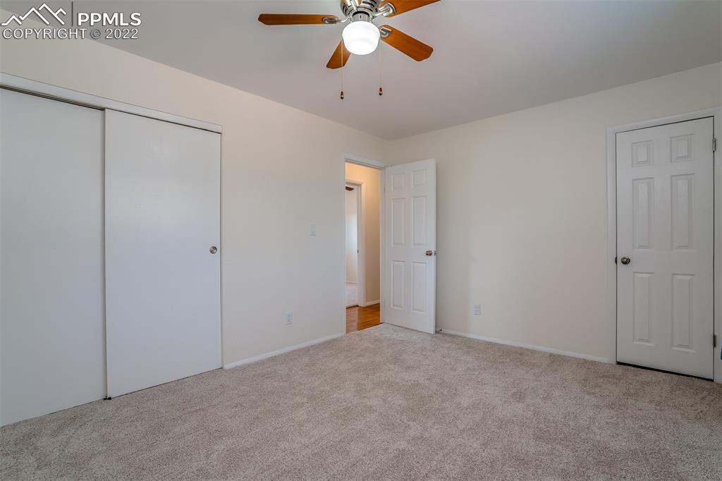 2515 Monterey Road Colorado Springs, CO 80910 - Photo 13 of 32 a view of an empty room and chandelier fan