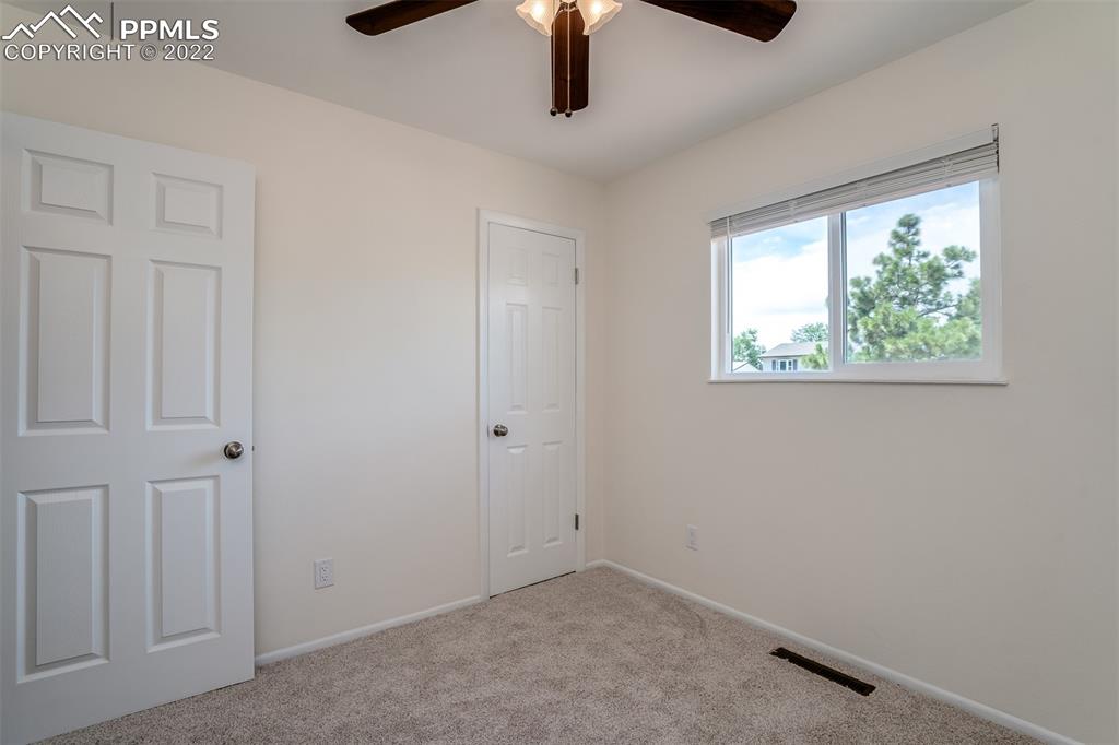 2515 Monterey Road Colorado Springs, CO 80910 - Photo 20 of 32 an empty room with windows