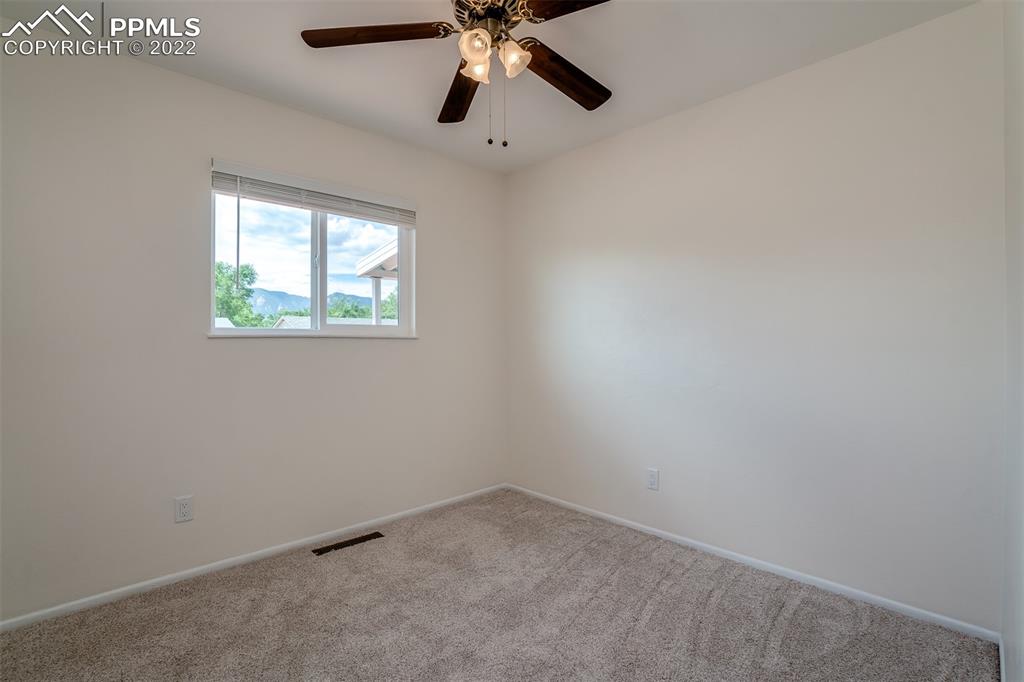 2515 Monterey Road Colorado Springs, CO 80910 - Photo 21 of 32 an empty room with windows and fan