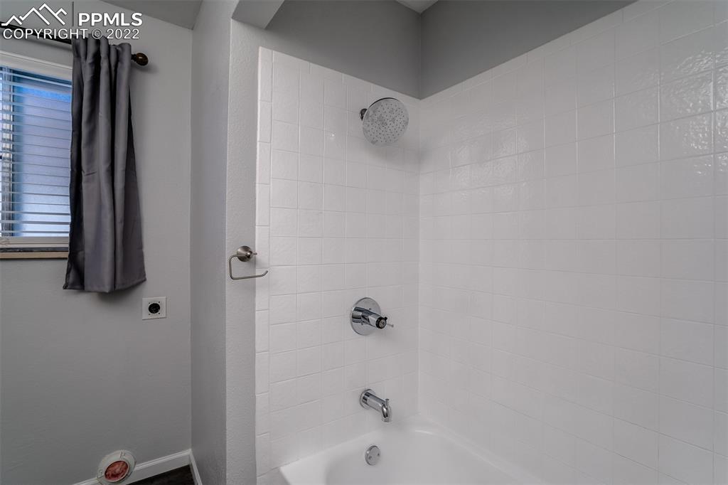 2515 Monterey Road Colorado Springs, CO 80910 - Photo 23 of 32 a bathroom with a bathtub