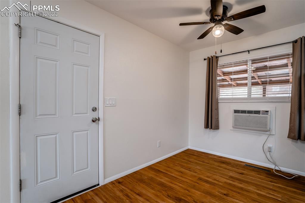 2515 Monterey Road Colorado Springs, CO 80910 - Photo 29 of 32 a view of empty room with wooden floor and fan